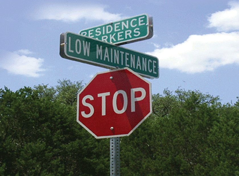 street signs and stop sign mounted on square sign post 